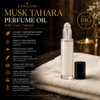Zamoori Musk Tahara Perfume Oil in a clear glass roller bottle with its black cap placed beside it on a textured cream towel. The background is a warm, dark, atmospheric setting with blurred candles, and the left side features descriptive text highlighting the product's clean, comforting scent and traditional use.